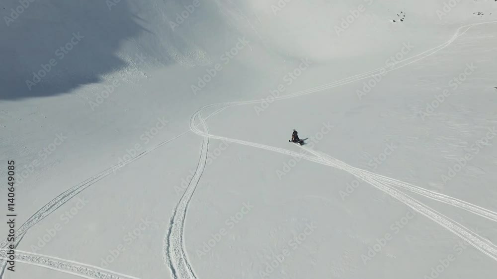 Man on snowmobile in winter mountain Man on snowmobile in winter mountain
