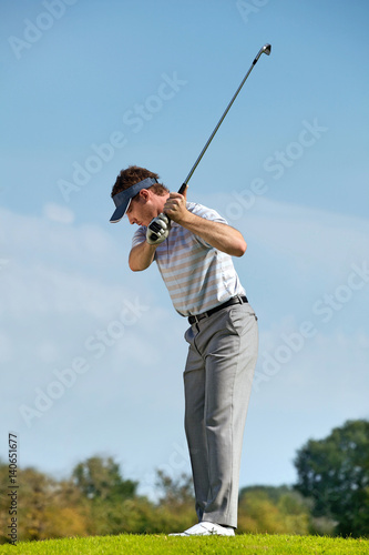 Young man playing golf