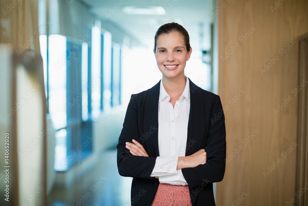 business executive standing with arms crossed