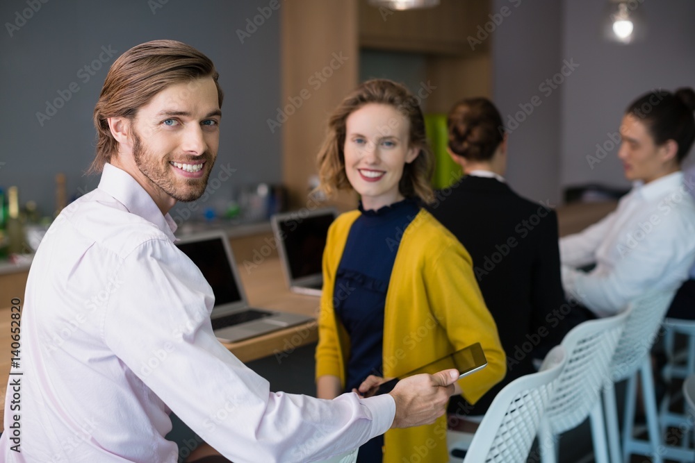 Business executives discussing on conference table Business executives discussing on conference table