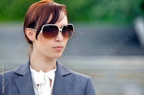 Close-up of a young woman wearing sunglasses