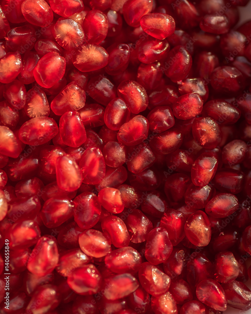 Fresh ripe pomegranate. Macro with shallow depth of field. Fresh ripe pomegranate. Macro with shallow depth of field.