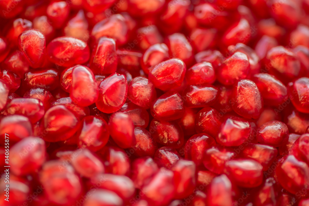 Fresh ripe pomegranate. Macro with shallow depth of field. Fresh ripe pomegranate. Macro with shallow depth of field.