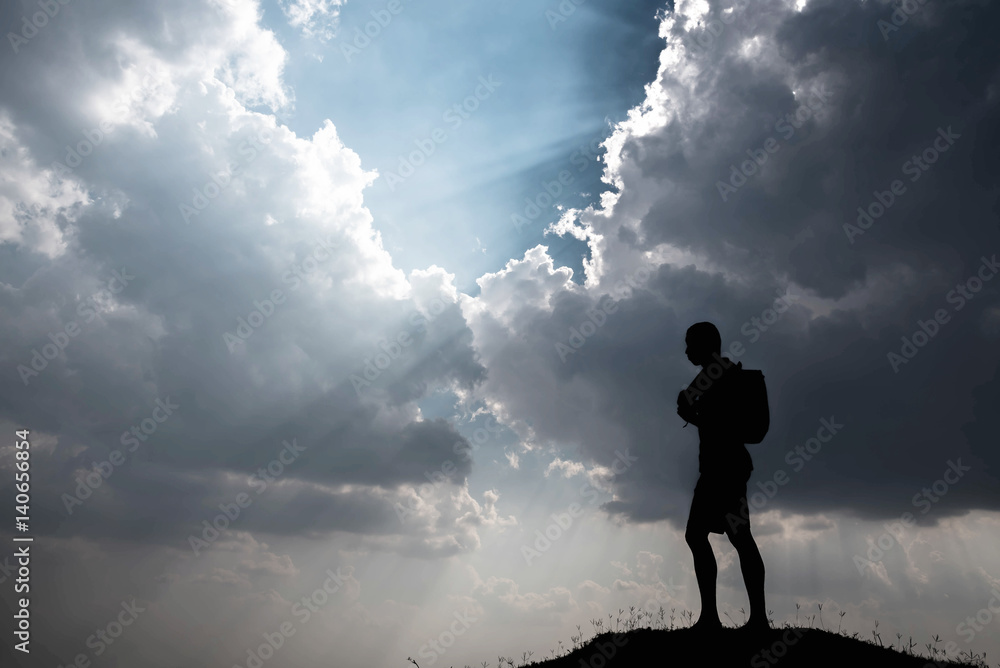 Silhouette of man and sky with sunlight Silhouette of man and sky with sunlight