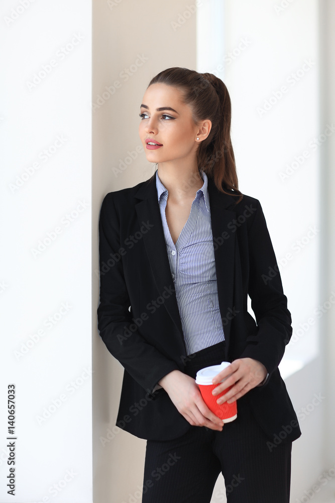 Beautiful business woman relax with cup of coffee Beautiful business woman relax with cup of coffee