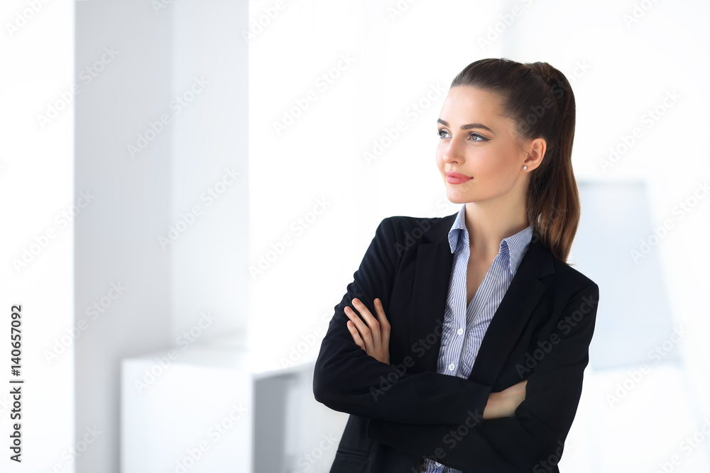 Portrait of young beautiful business woman in the office Portrait of young beautiful business woman in the office