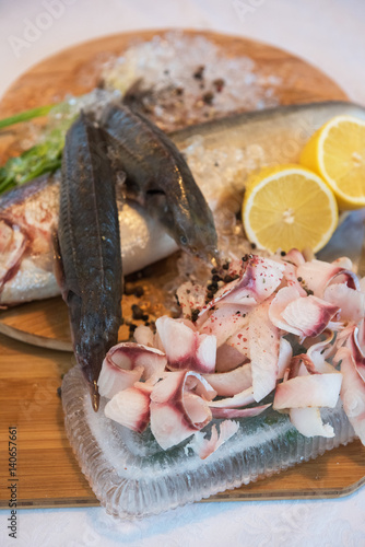 Sliced frozen raw fish from...