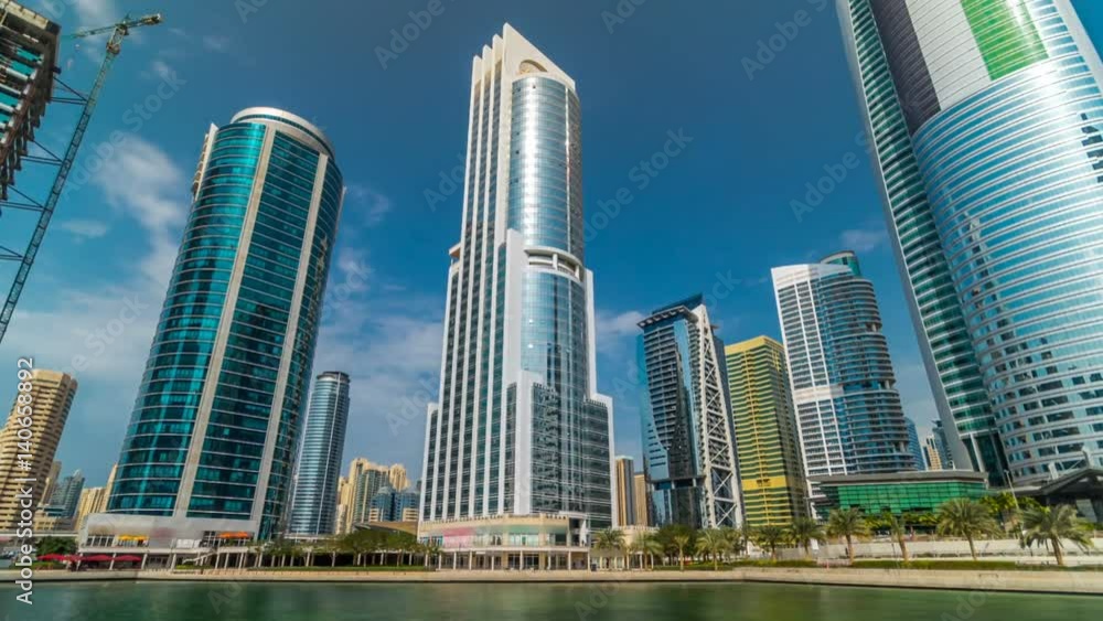 Residential buildings in Jumeirah Lake Towers timelapse hyperlapse in Dubai, UAE. Residential buildings in Jumeirah Lake Towers timelapse hyperlapse in Dubai, UAE.