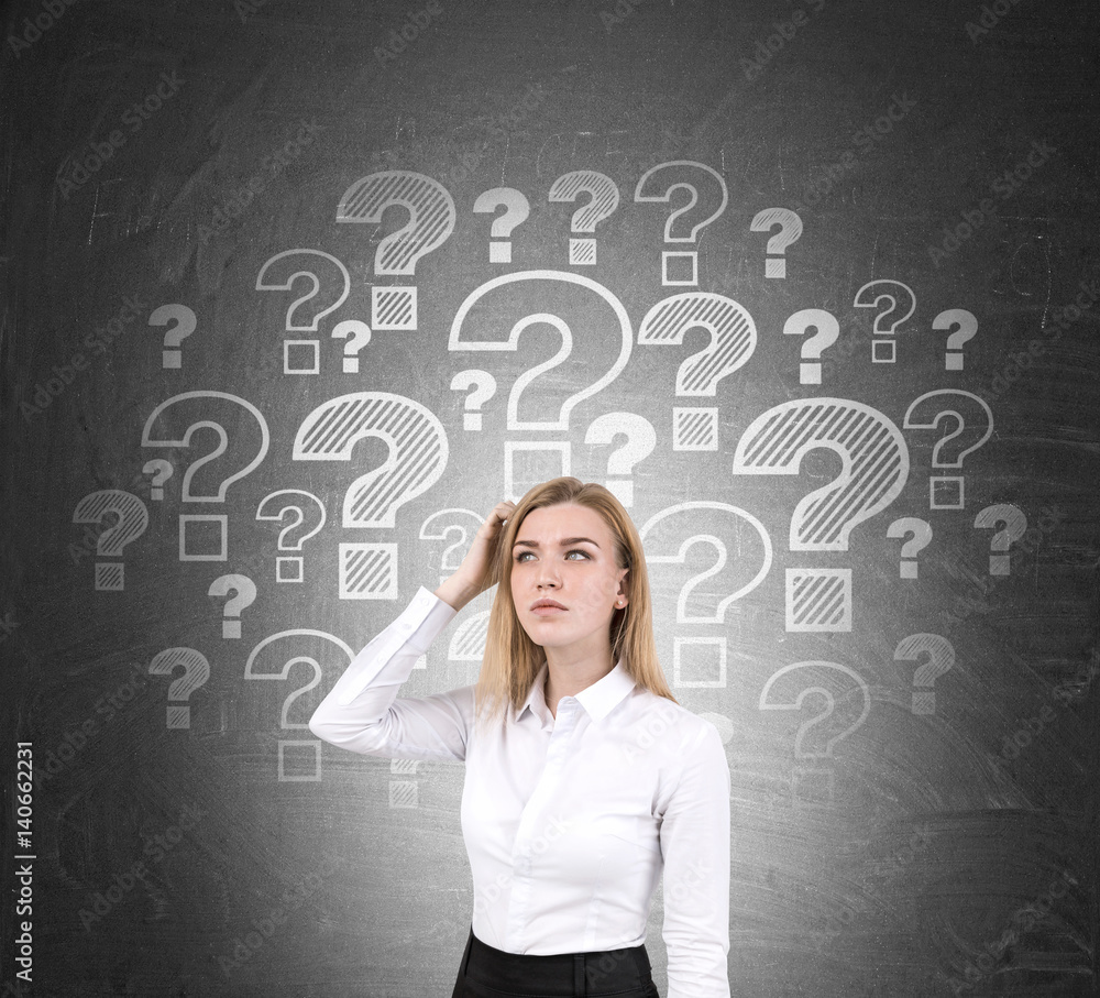 Confused blond woman and question marks Confused blond woman and question marks