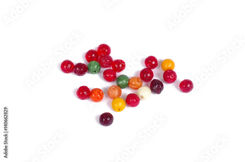 Pressed multicolored glass beads on white background - isolated