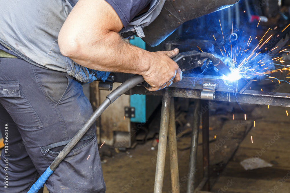 Welding work going on in a workshop Welding work going on in a workshop