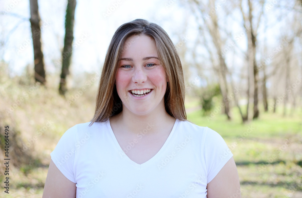 Portrait of happy beautiful young woman enjoying sun light in the park. Portrait of happy beautiful young woman enjoying sun light in the park.