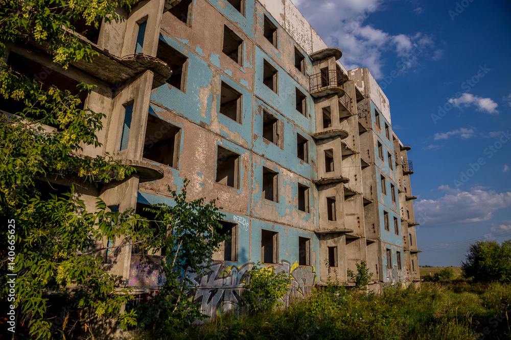 Abandoned five-story house in ghost-town, summer, Russia, Samara region Abandoned five-story house in ghost-town, summer, Russia, Samara region