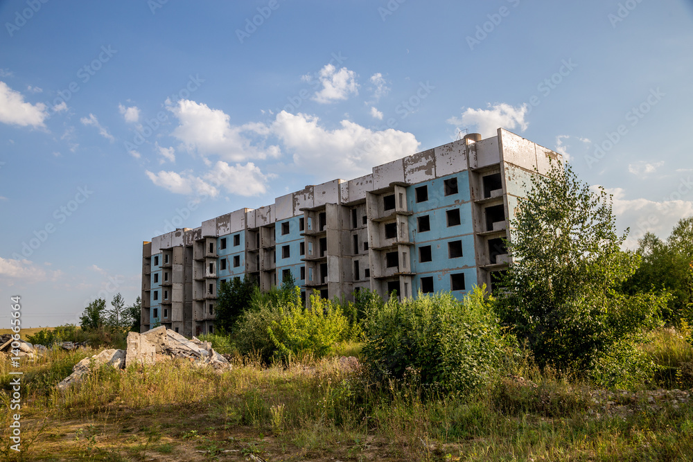 Abandoned five-story house in ghost-town, summer, Russia, Samara region