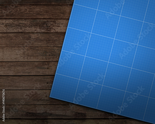 Abstract techno background with blue prints surface on wooden table