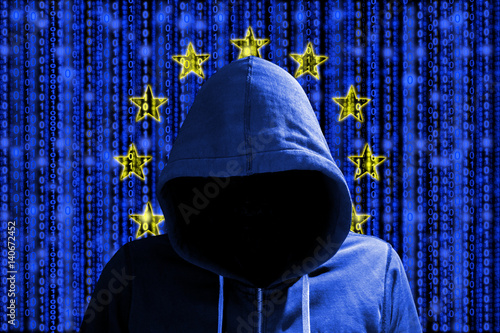 European hacker in front of digital datastream flag