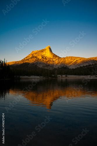 Alpine Glow on Cathedral Peak reflected in Lower Cathedral Lake in Yosemite National Park