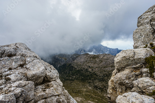 Rocky mountains and a clouded sky © lakkot