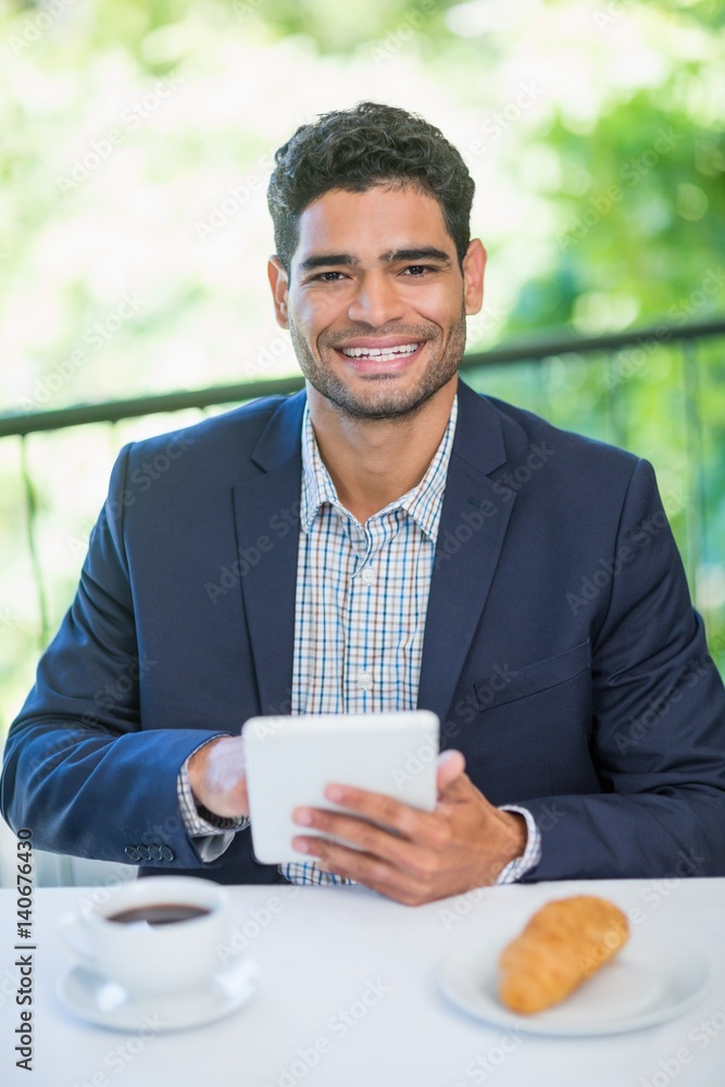 Portrait of happy businessman holding digital tablet Portrait of happy businessman holding digital tablet