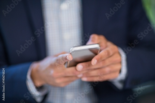 Businessman using mobile phone