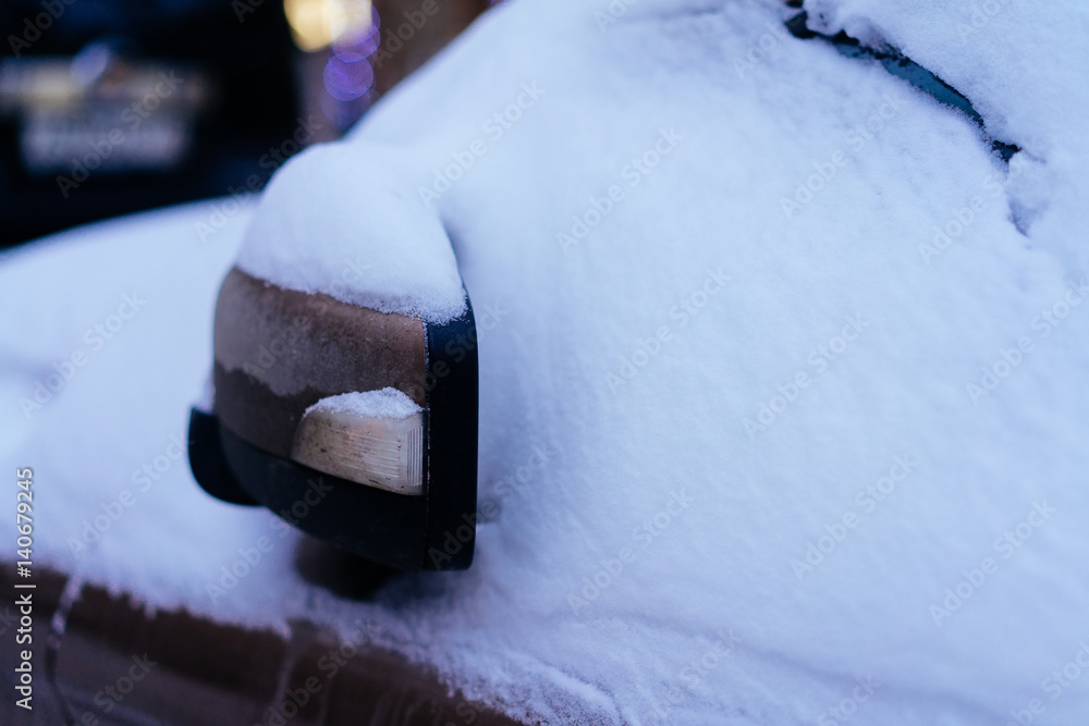 Close-up of snow-covered car wing mirror Close-up of snow-covered car wing mirror