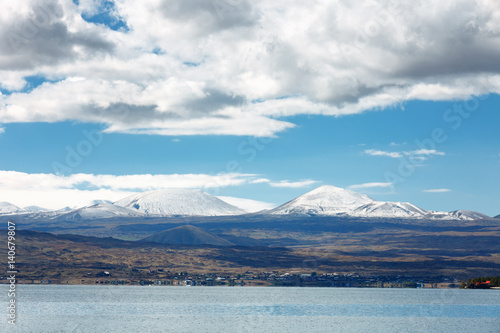 Sevan lake and white clouds blue sky on a sunny day, Armenia © photoaliona
