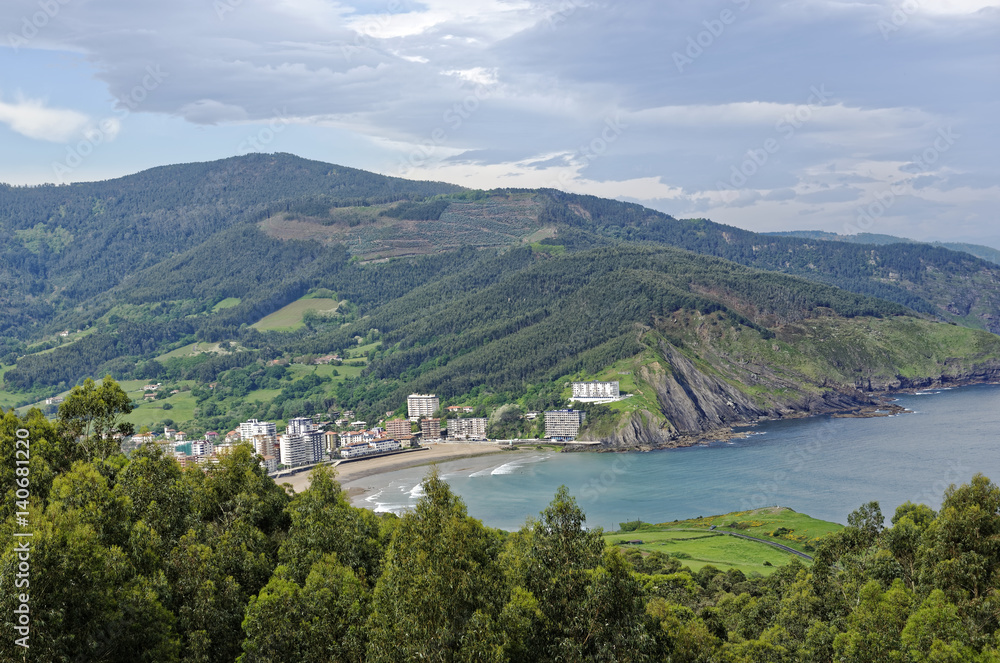 Scenic overlook of the Basque village of Bakio and coastline in Northern Spain