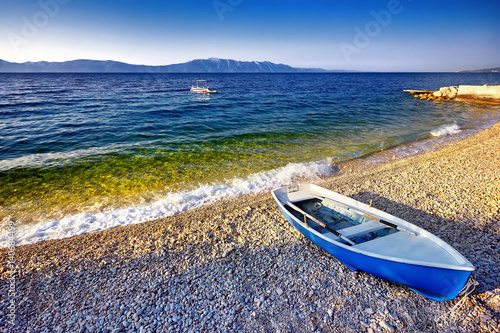 Boat on the beach at sunrise time