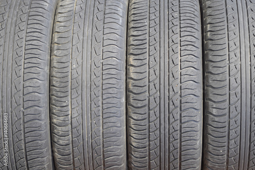 The background of the tread pattern of the car wheel. Rubber tir