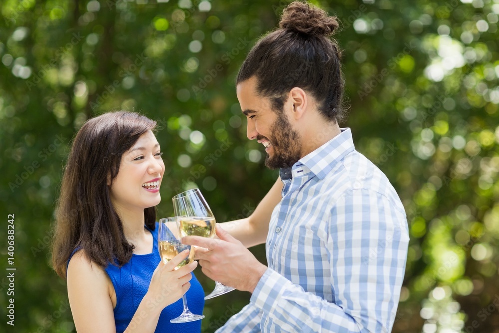 Couple toasting glasses of wine in a restaurant Couple toasting glasses of wine in a restaurant