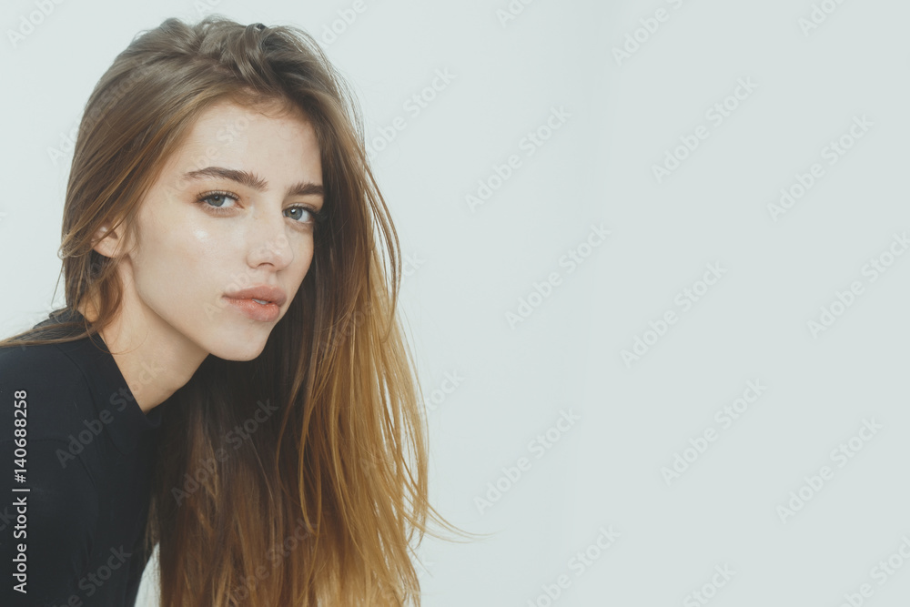 Naklejka premium Pretty girl with long blond hair in black