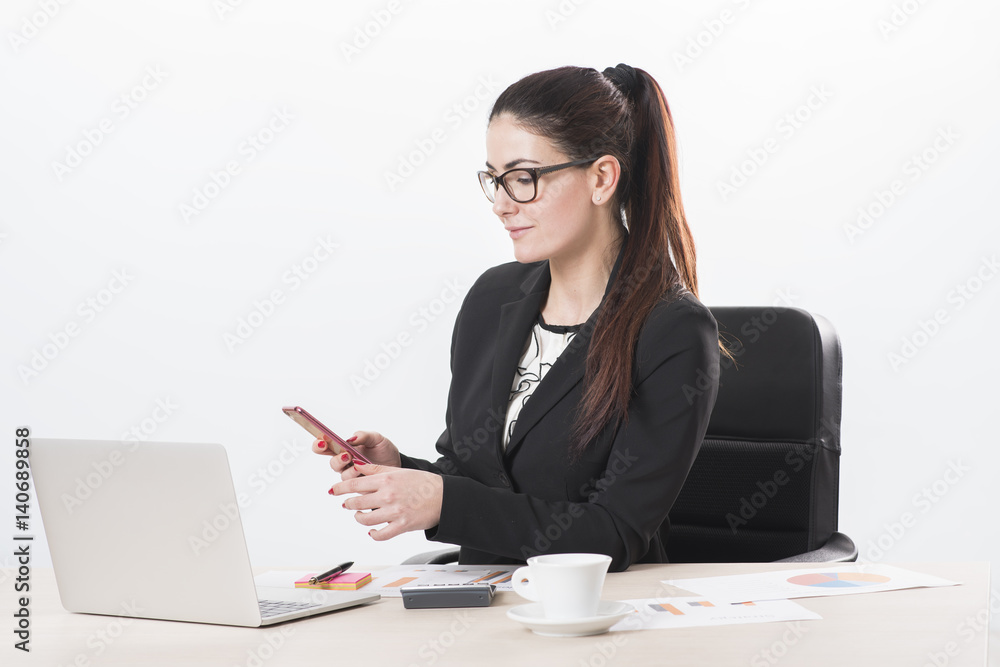 businesswoman using a cell phone businesswoman using a cell phone