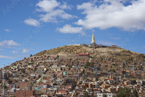 Statue of Christ the Redeemer on a high overlooking the mining town of Oruro on the altiplano of Bolivia. 