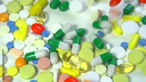 Medical pills falling down. Medicine concept. Treatment Many coloured capsules, pills. Full HD. Slow motion 240 fps. HD 1080p 