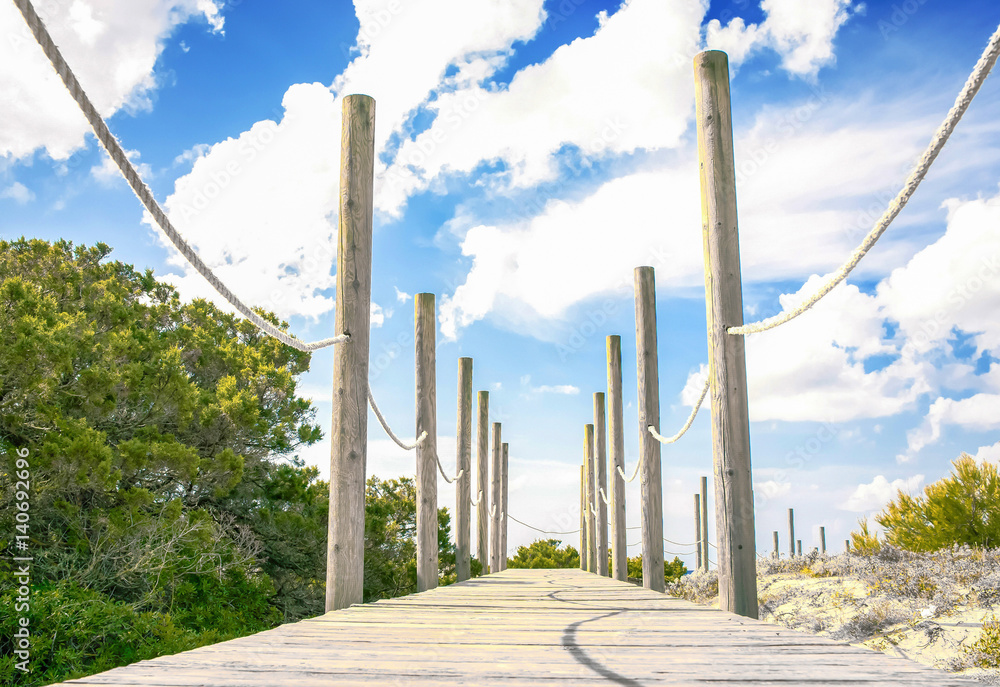 Fototapeta premium Beach jetty at beach in Santo Tomas, Menorca, Spain