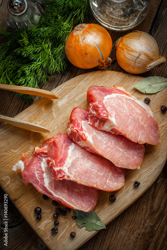 Slices of raw pork.