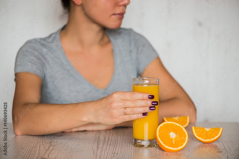 healthy drink, diet, detox and people concept - close up of woman with orange juice in glass healthy drink, diet, detox and people concept - close up of woman with orange juice in glass