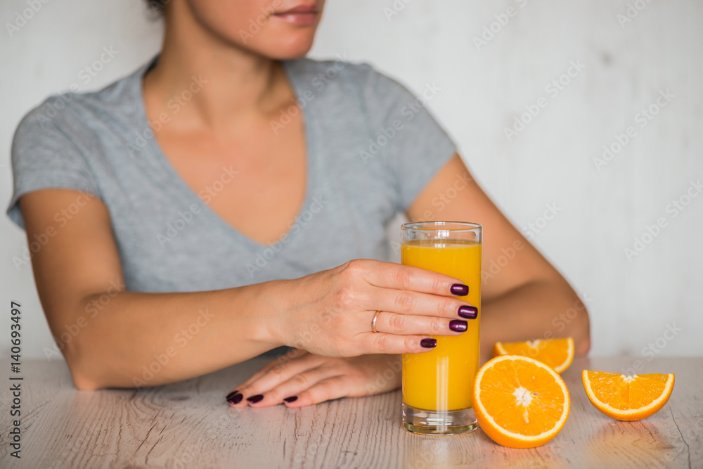 healthy drink, diet, detox and people concept - close up of woman with orange juice in glass healthy drink, diet, detox and people concept - close up of woman with orange juice in glass
