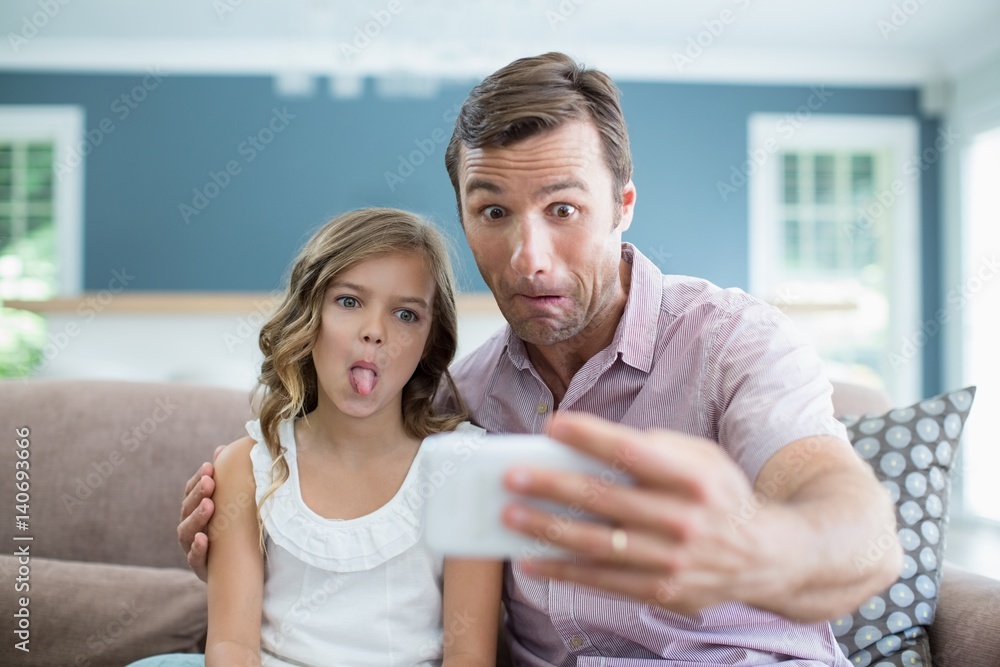 Father and daughter pulling funny faces Father and daughter pulling funny faces