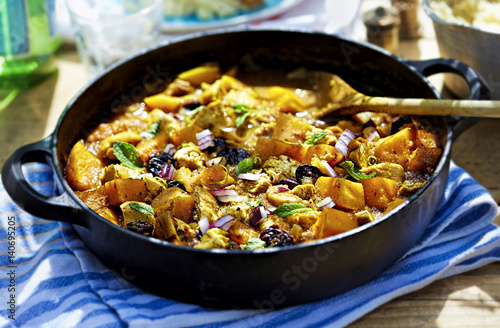 Moroccan one pot tajine - fried chicken with pumpkin, cherries and red onion