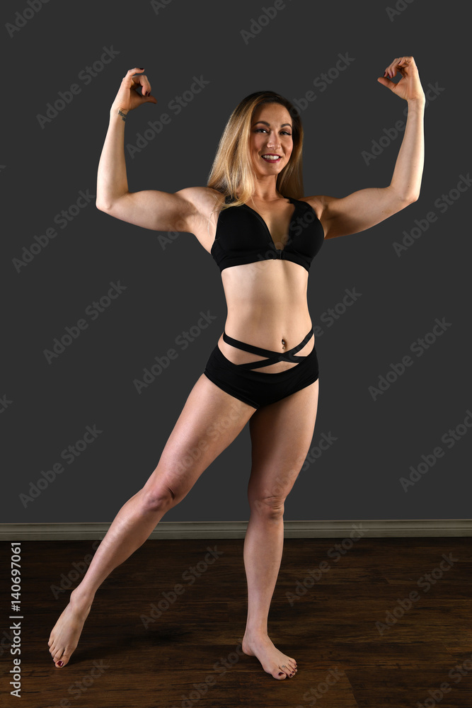 Young woman Flexing Biceps
