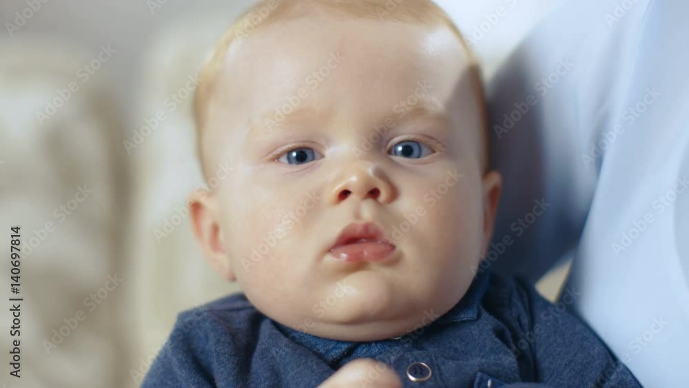 Close-up Shot of a Serene Baby Looking into the Camera. Shot on RED EPIC-W 8K Helium Cinema Camera. Close-up Shot of a Serene Baby Looking into the Camera. Shot on RED EPIC-W 8K Helium Cinema Camera.