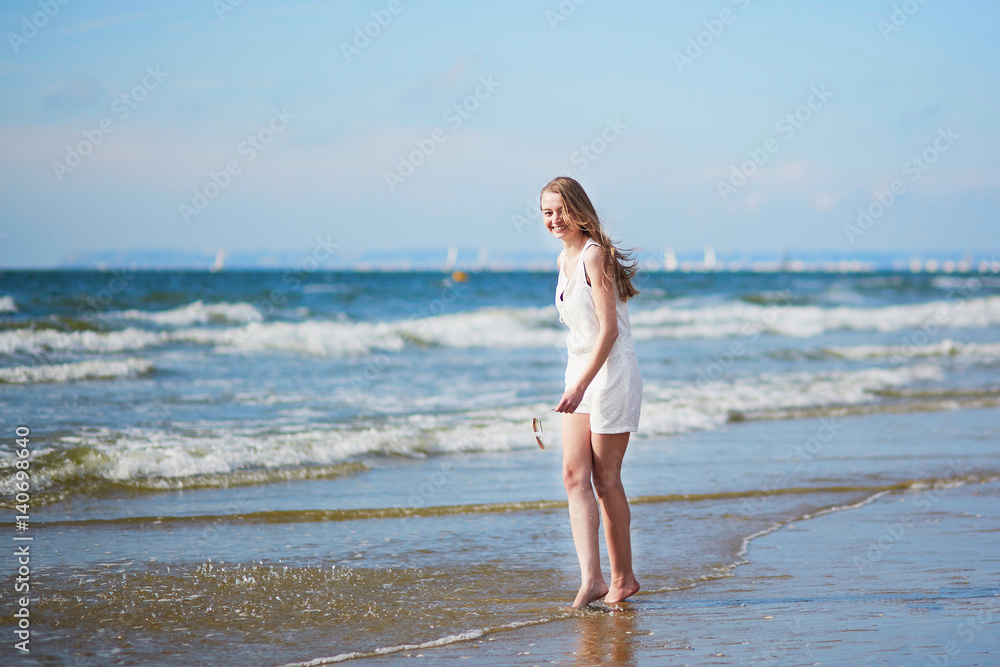 Young woman enjoying her vacation by sea Young woman enjoying her vacation by sea