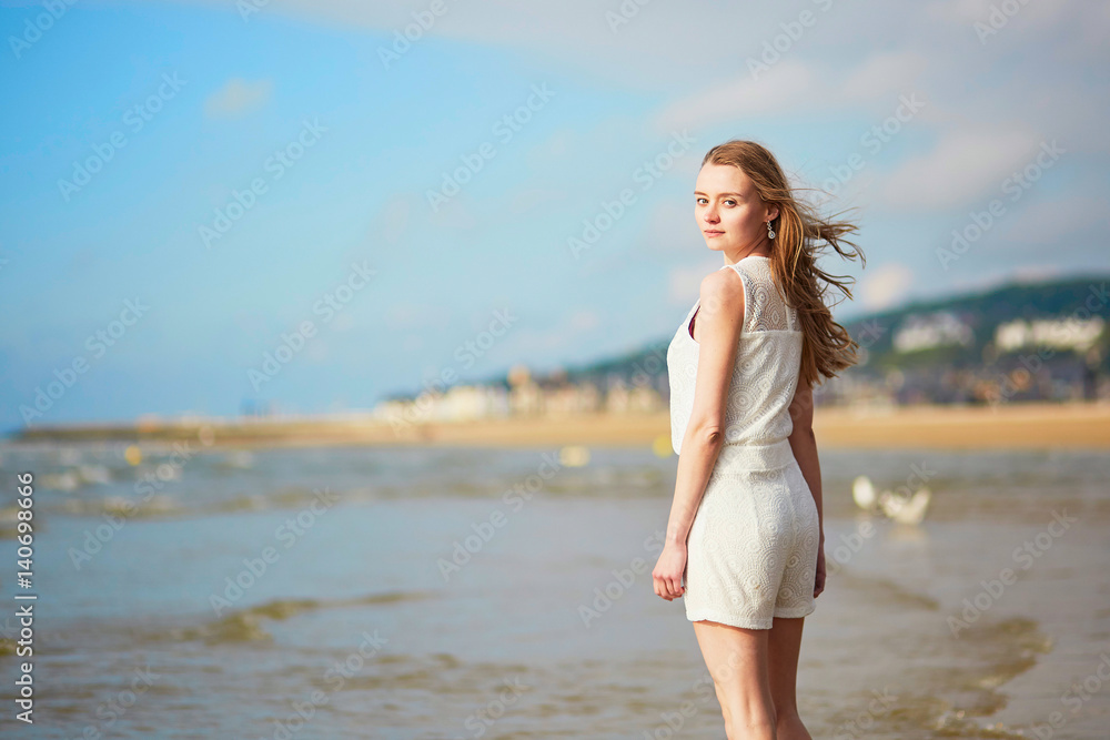 Young woman enjoying her vacation by sea