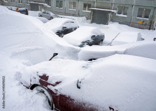 Wallpaper Mural Cars stand in the yard of the house, covered with snow Torontodigital.ca