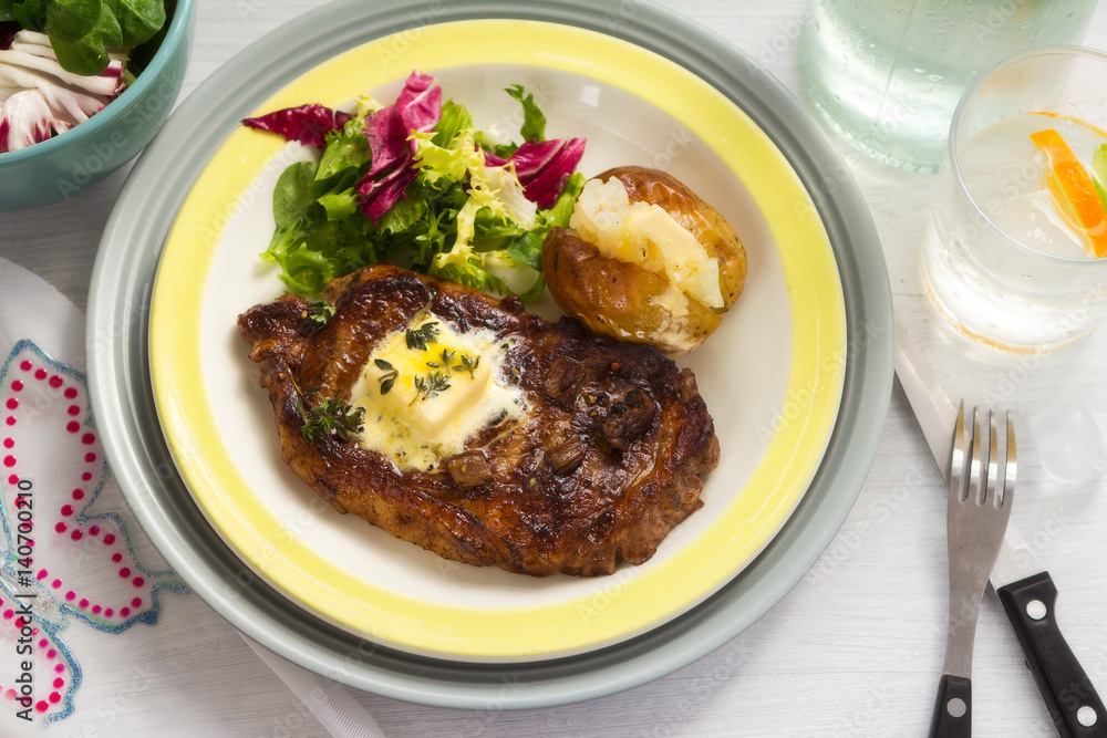 Summer steak with baked potato and salad Summer steak with baked potato and salad