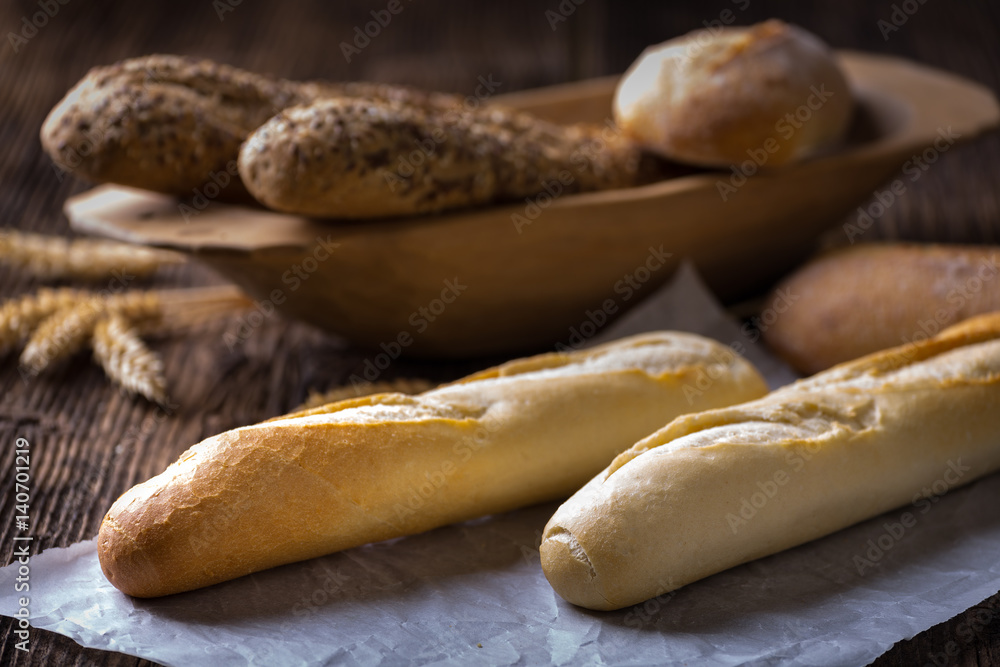 Freshly baked white and brown baguette