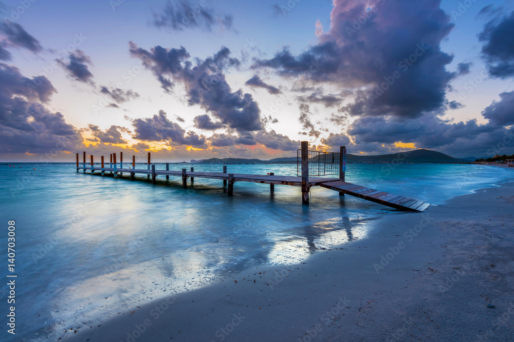 Obraz premium Wooden pier in the Mediterranean Sea, Alghero, Sardinia, Italy
