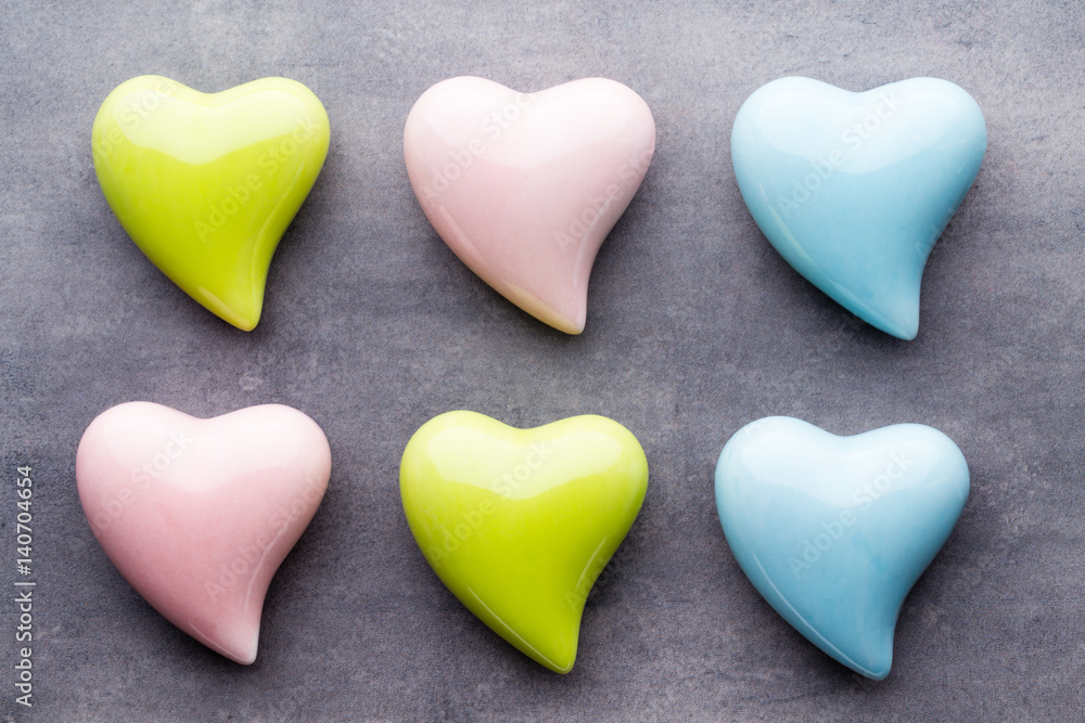 Colored heart on the gray background. View from above. Flat lay. Colored heart on the gray background. View from above. Flat lay.