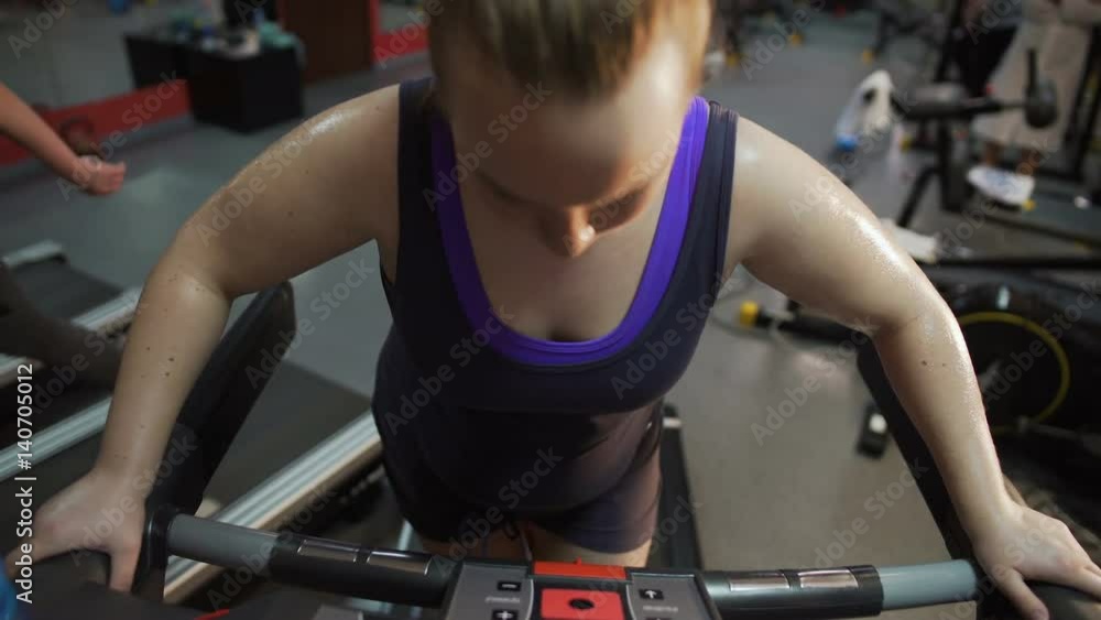 Hardworking obese lady working hard in gym, aspiring to be slim and healthy Hardworking obese lady working hard in gym, aspiring to be slim and healthy